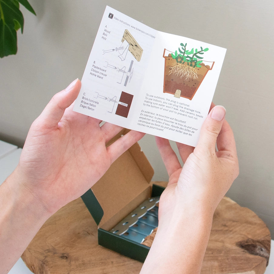 Instruktionsark til Clippy vægbeslag, visning af montering til plantevæg