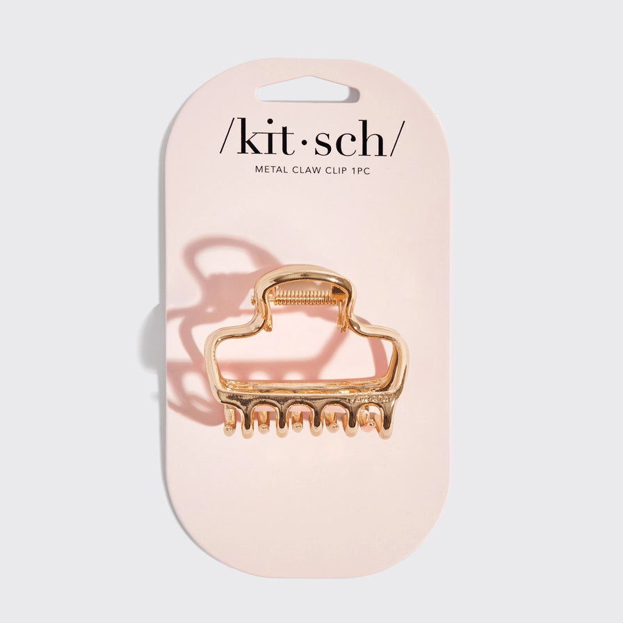 Kitsch metal klip i guld på emballagen