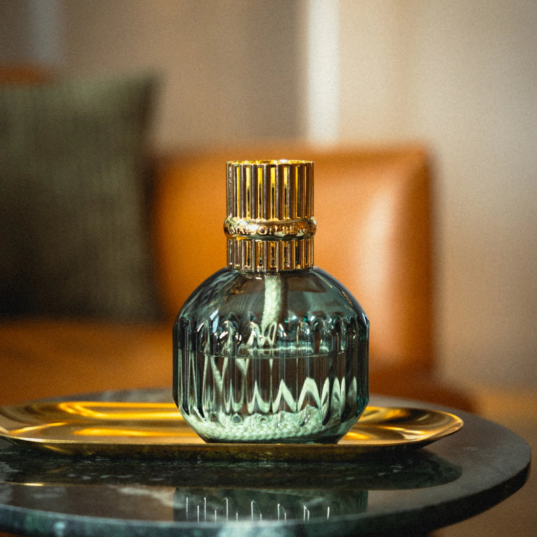 Detalje af guldtop på Maison Berger duftlampe