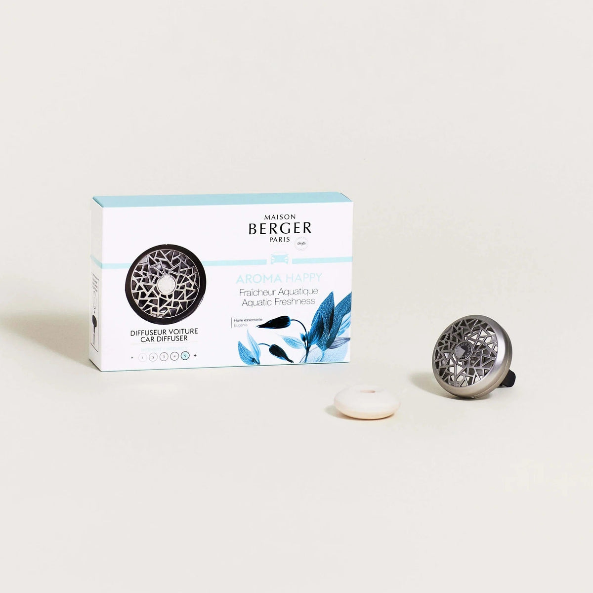 Gør din kørsel til en glædelig og opfriskende oplevelse med duften Aroma Happy til Bil luftfriskeren fra Maison Berger Paris