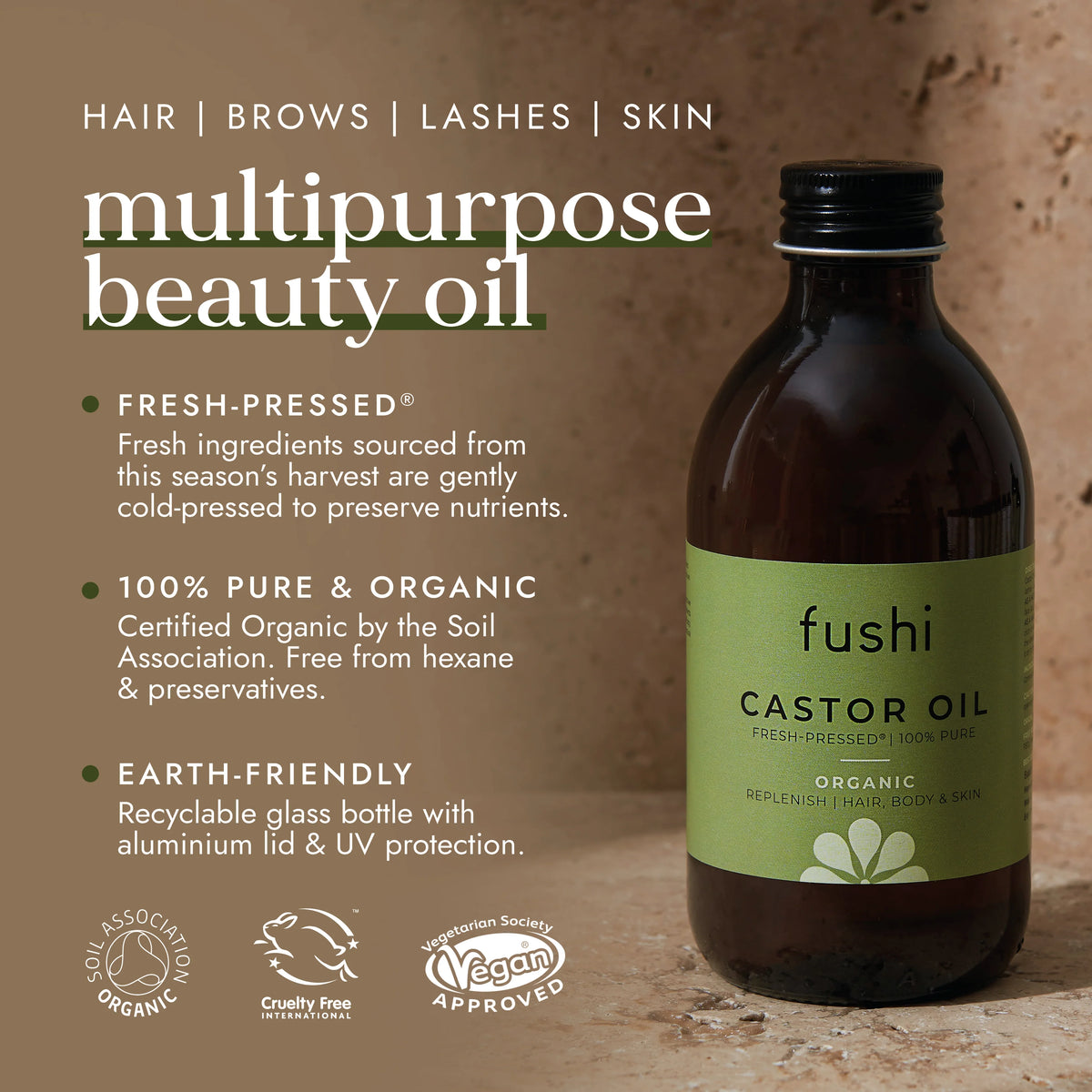 Pouring castor oil from a dark glass bottle onto a hand, emphasizing natural hair and skin nourishment