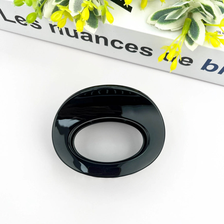 Sort oval mini hårklemme i bæredygtig plast