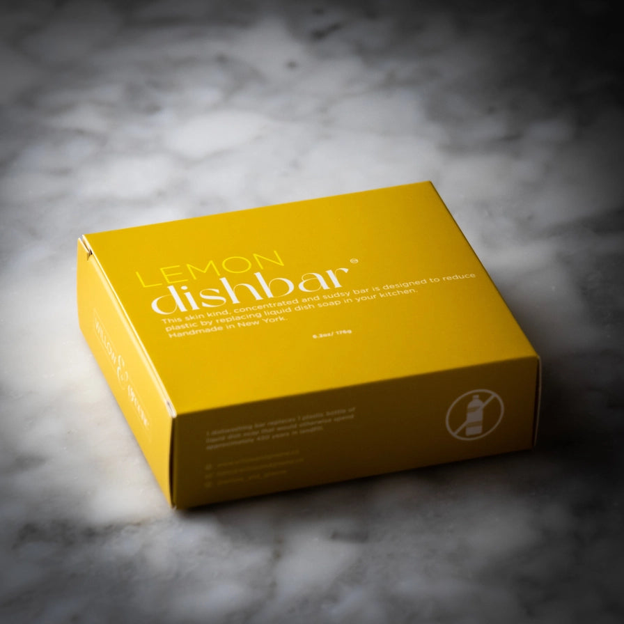 Plastikfri opvaskebar med citron til bæredygtig opvask i hjemmet