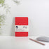 Rød recycled læder notesbog med elastiklukning og embossing